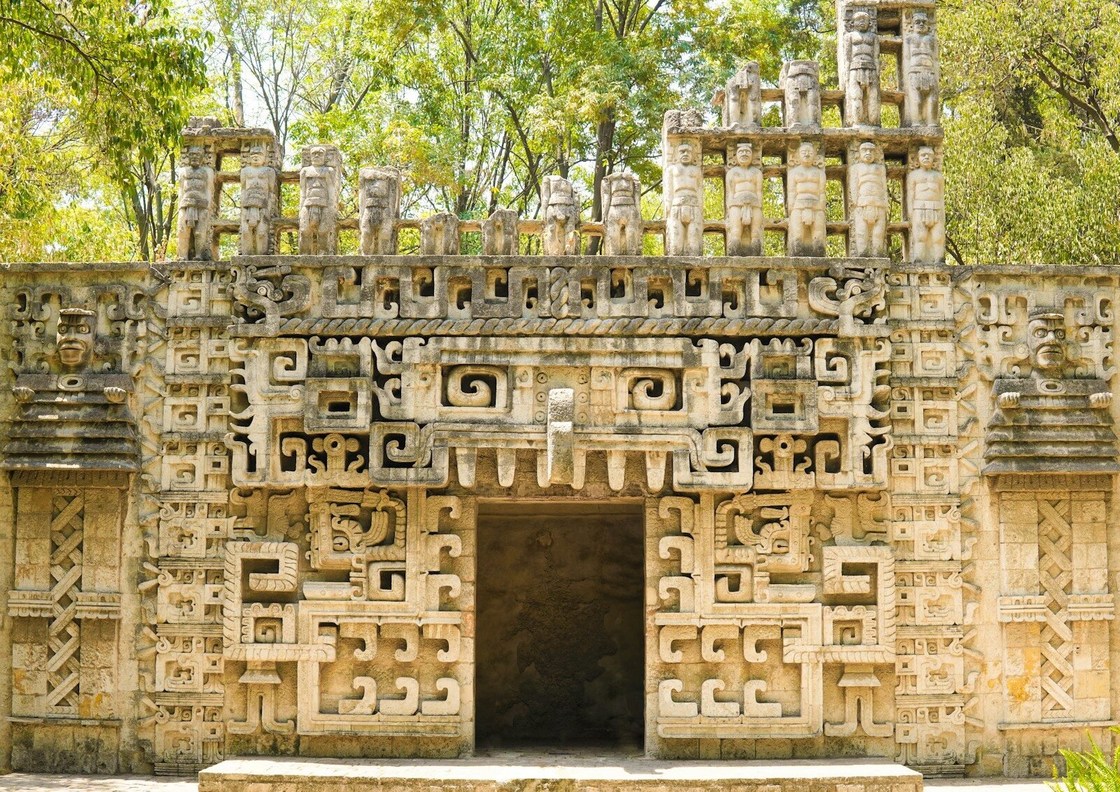 a stone structure with carvings on the front of it